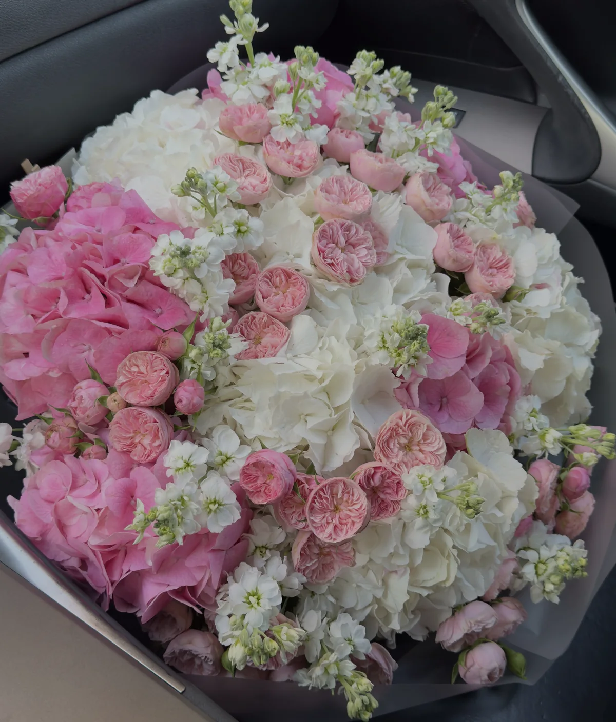 Bouquet of pink and white hydrangeas, garden roses and stock